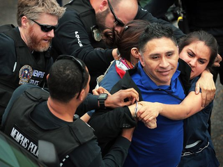 Memphis police arrest Manuel Duran, a reporter for Spanish-language media, during a Memphis protest last week.